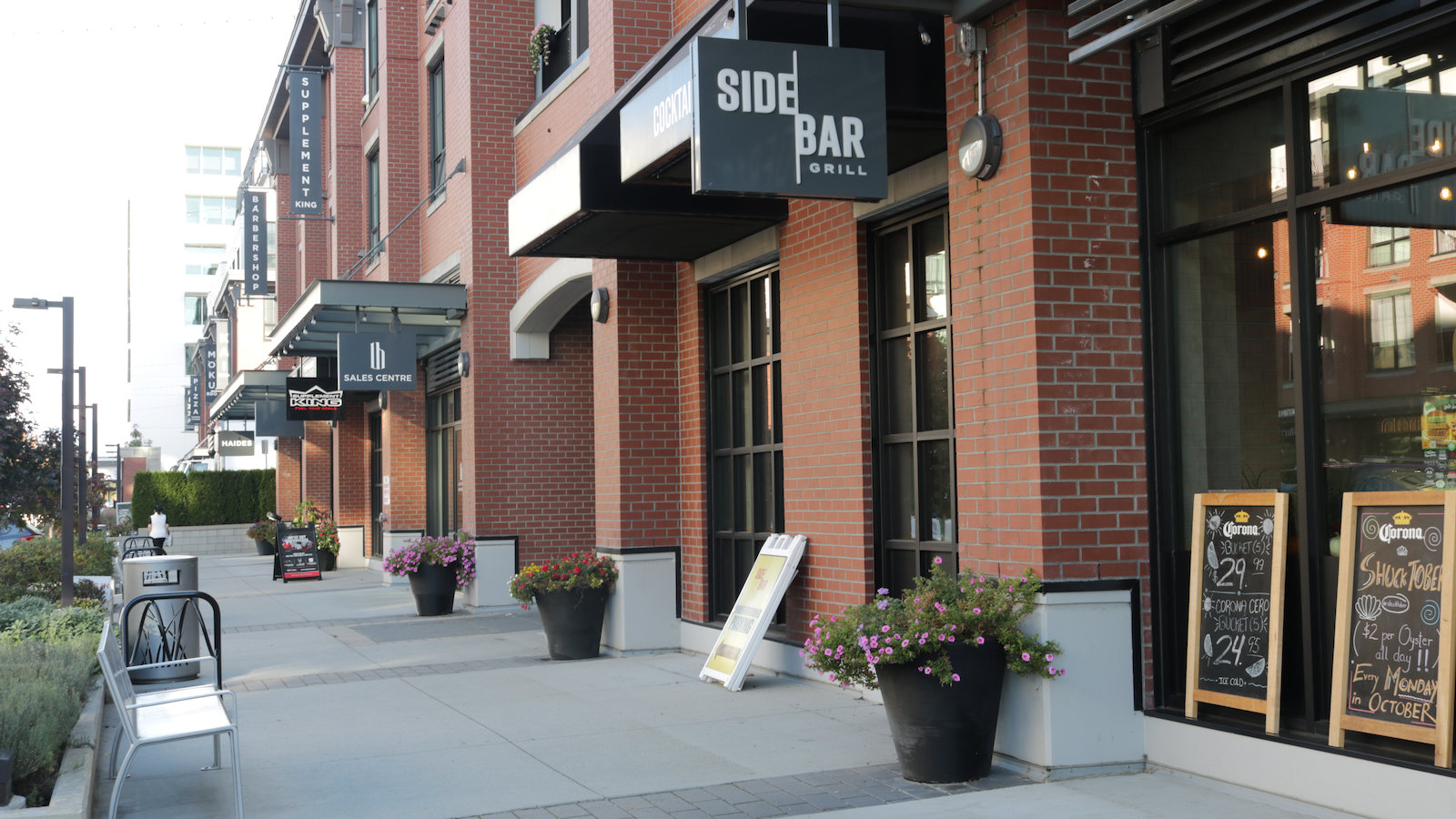 Brick storefronts, local businesses and pedestrian sidewalks in Willoughby, Langley BC